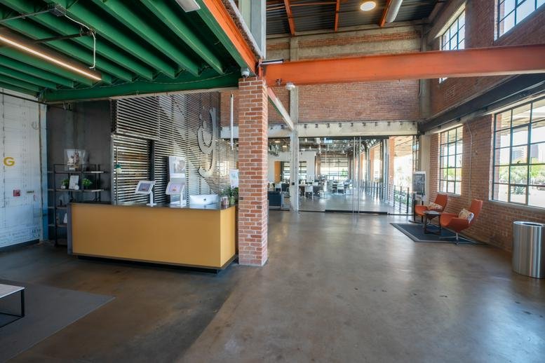 Spacious industrial-style reception and lobby area at 515 E Grant Street, Warehouse District.