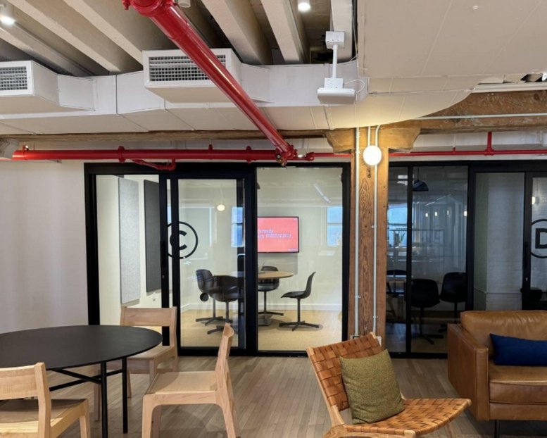 Private meeting room at 53 Beach Street, Tribeca, Manhattan, New York City seen through glass doors.