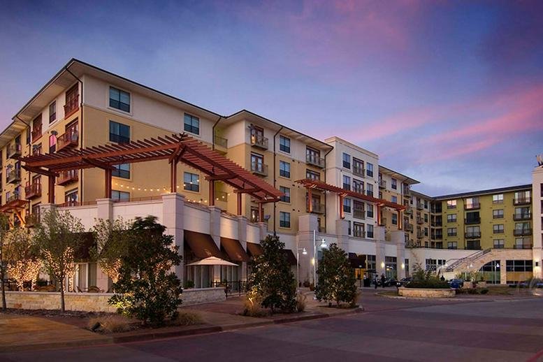 Exterior of 5301 Alpha Road, Galleria, Dallas, Texas with modern architecture and a dusk sky.