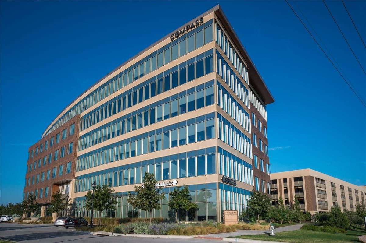 Exterior view of the glass and brick facade at 550 Reserve Street, Suite 150 & 250.