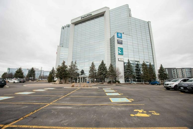 Exterior view of the multi-story glass and concrete WorkPod building at 5500 North Service Road.