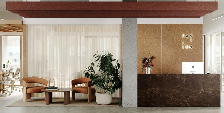 Wide view of Pavilion Stadium Beatty featuring a marble reception desk and cozy lounge area.