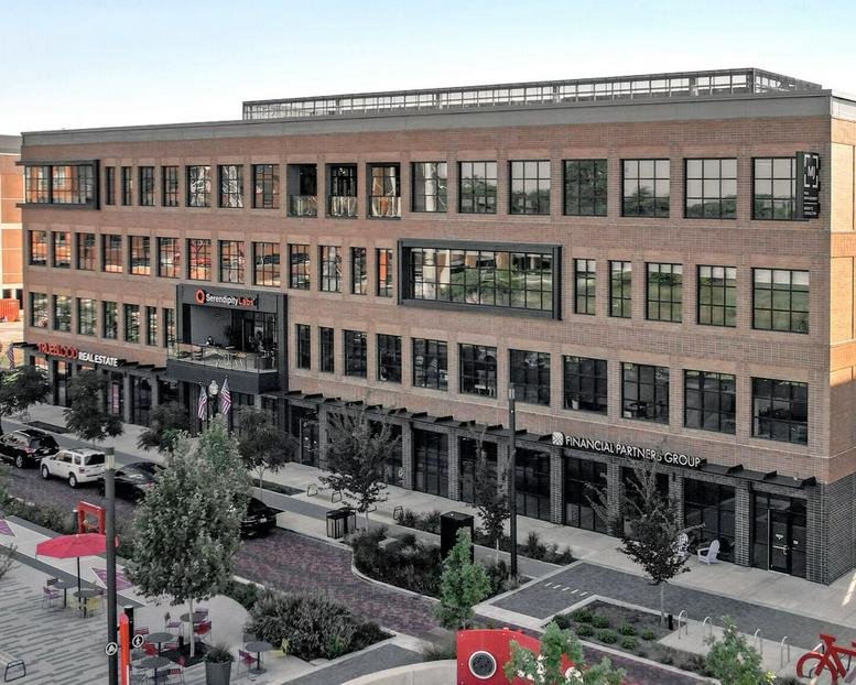 Exterior view of the brick facade at 571 Monon Green Boulevard.