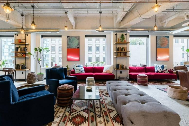 Vibrant lobby at 575 Market St, San Francisco, California featuring velvet seating and bold artwork.
