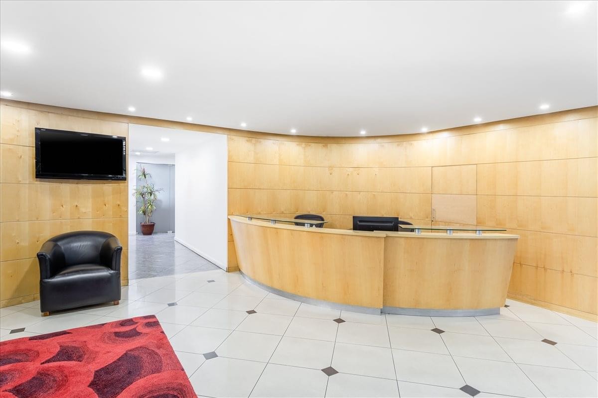 The wood-paneled reception area at Europlaza Business Center, Tower 1, 2nd Floor, Zone 14.