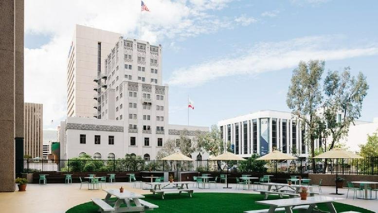 Exterior view of the historic white facade of 600 B Street in San Diego.