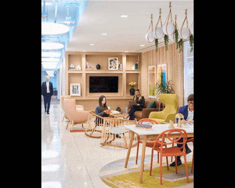 Modern lounge at 600 Mamaroneck Avenue with colorful seating and stylish pendant lighting.