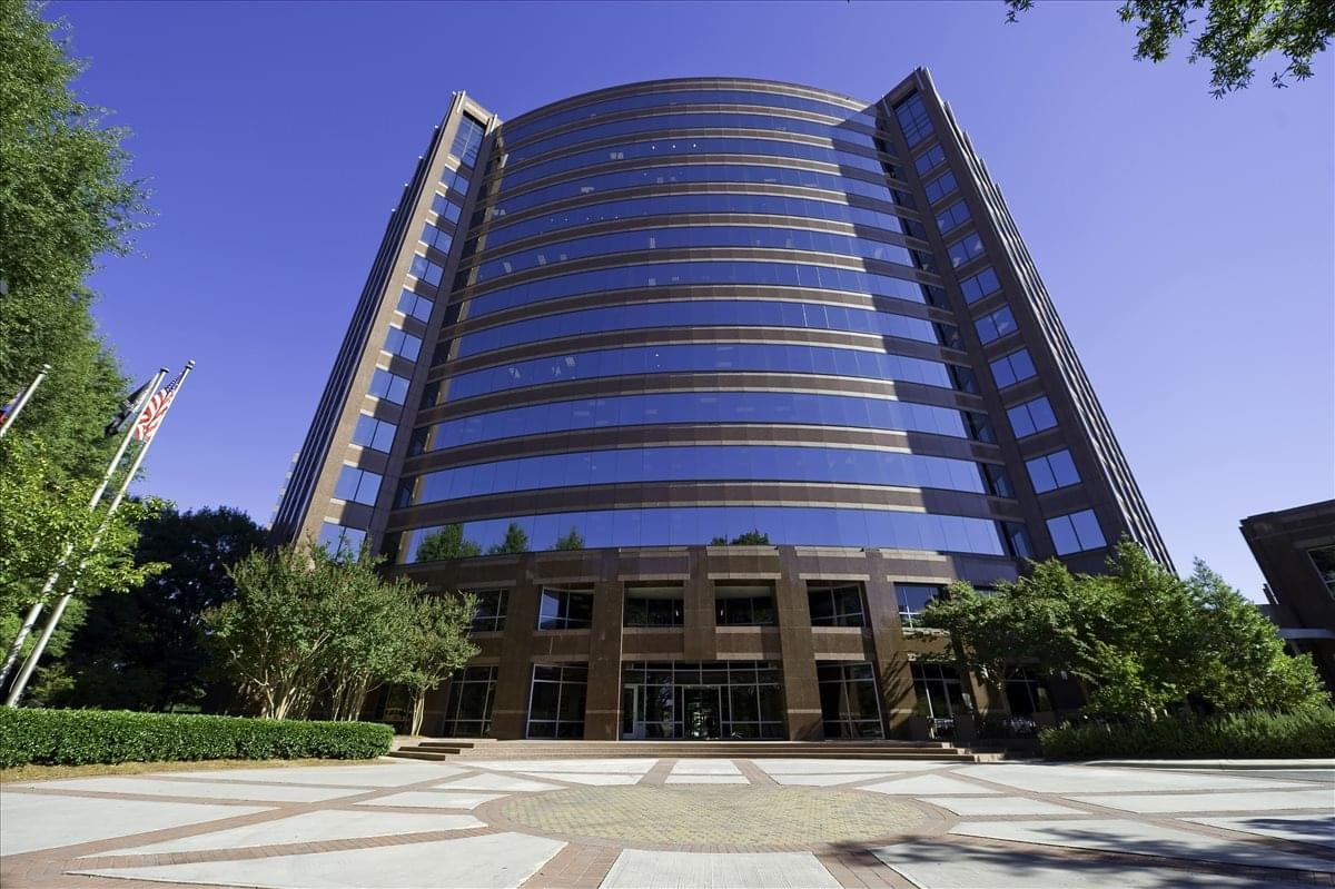 Exterior view of the curved glass facade at SouthPark Towers Fairview Center.