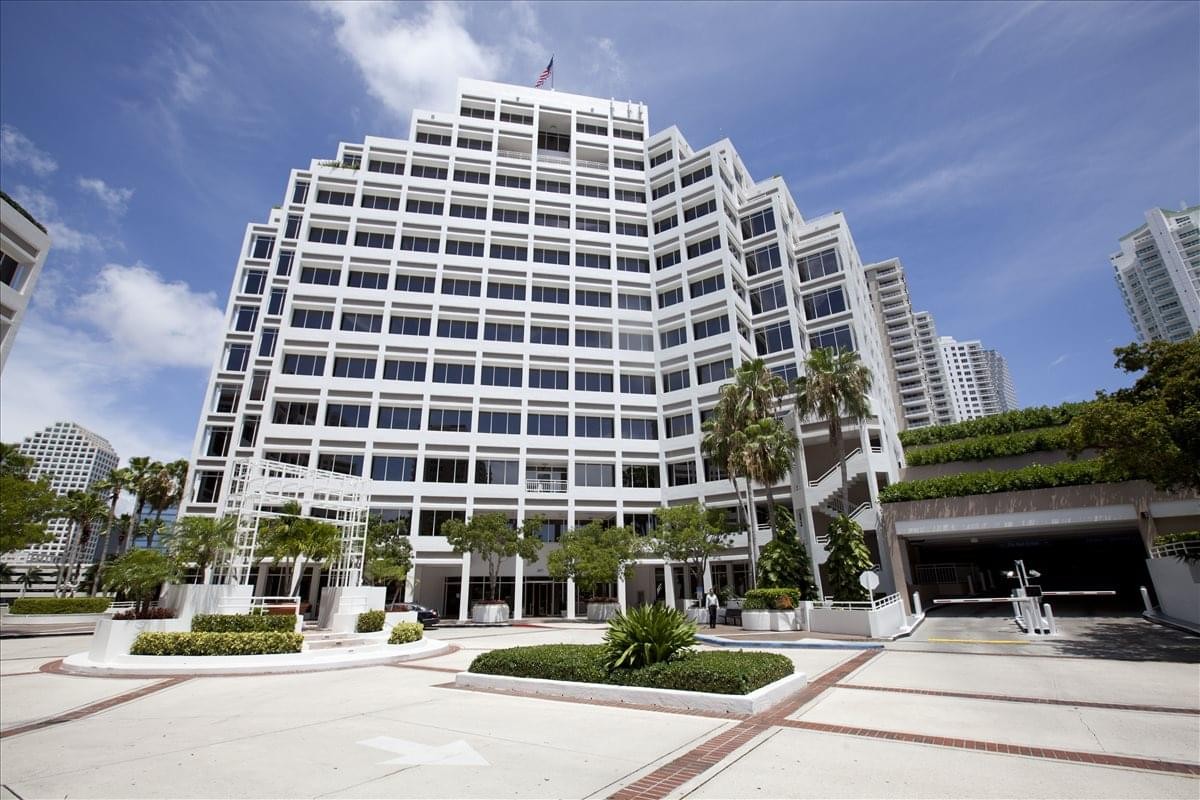 The tiered white exterior building at 601 Brickell Key Drive, Suite 700.