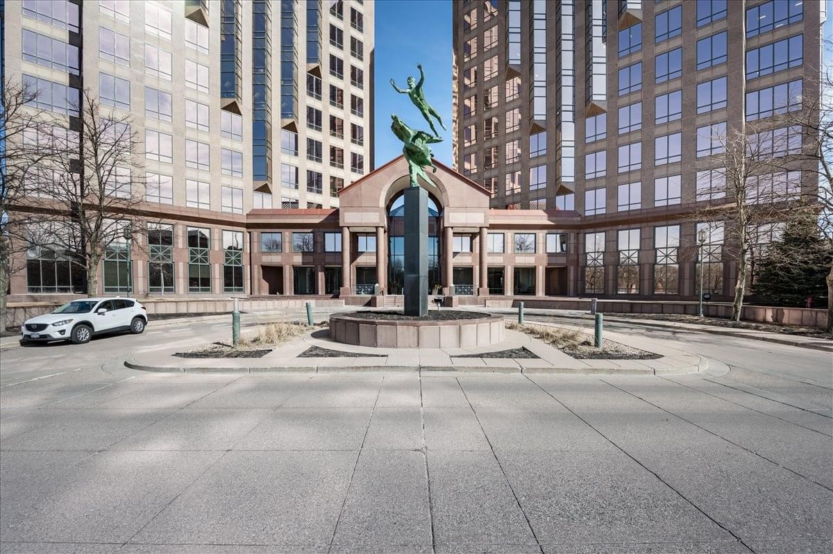 Exterior view of the brick facade and grand entrance at 601 Carlson Parkway, Carlson Center.