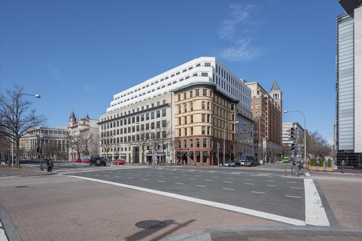 Exterior view of the historic South Building at 601 Pennsylvania Avenue NW with modern upper levels.