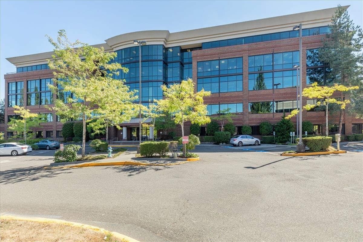 Exterior view of the Redstone Corporate Centre, a multi-story brick and glass building.