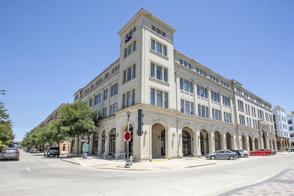 Exterior view of the classic stone facade at 6136 Frisco Square Boulevard, Suite 400.