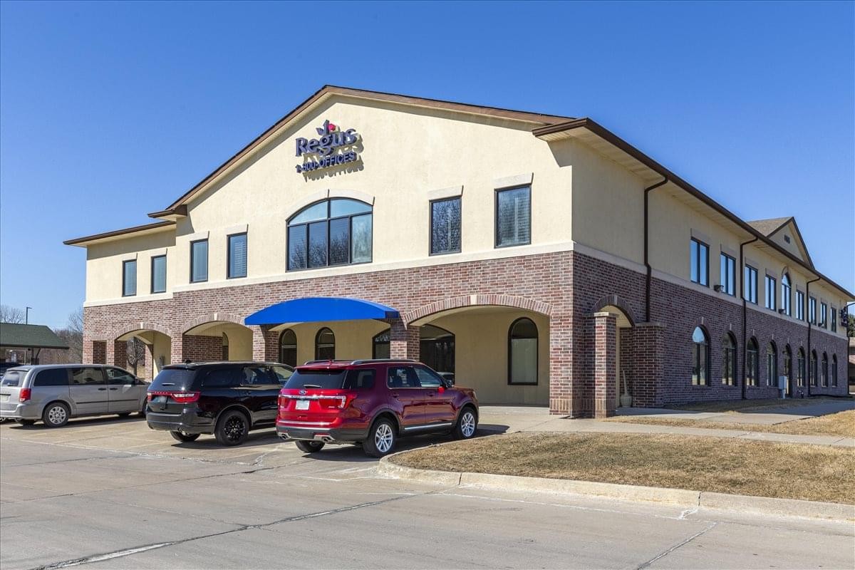 Exterior view of the two-story brick and tan building at 6165 North West 86th Street.
