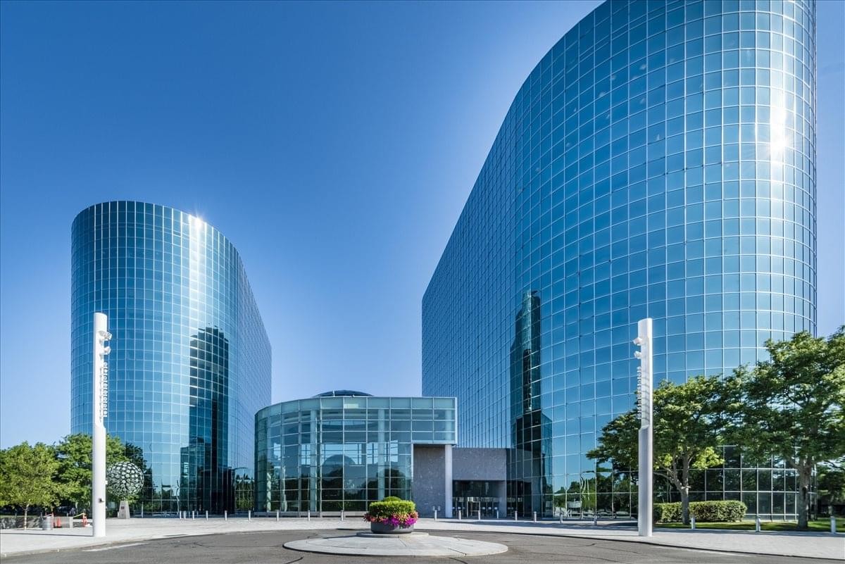 Exterior view of the curved glass facade at 626 RexCorp Plaza.