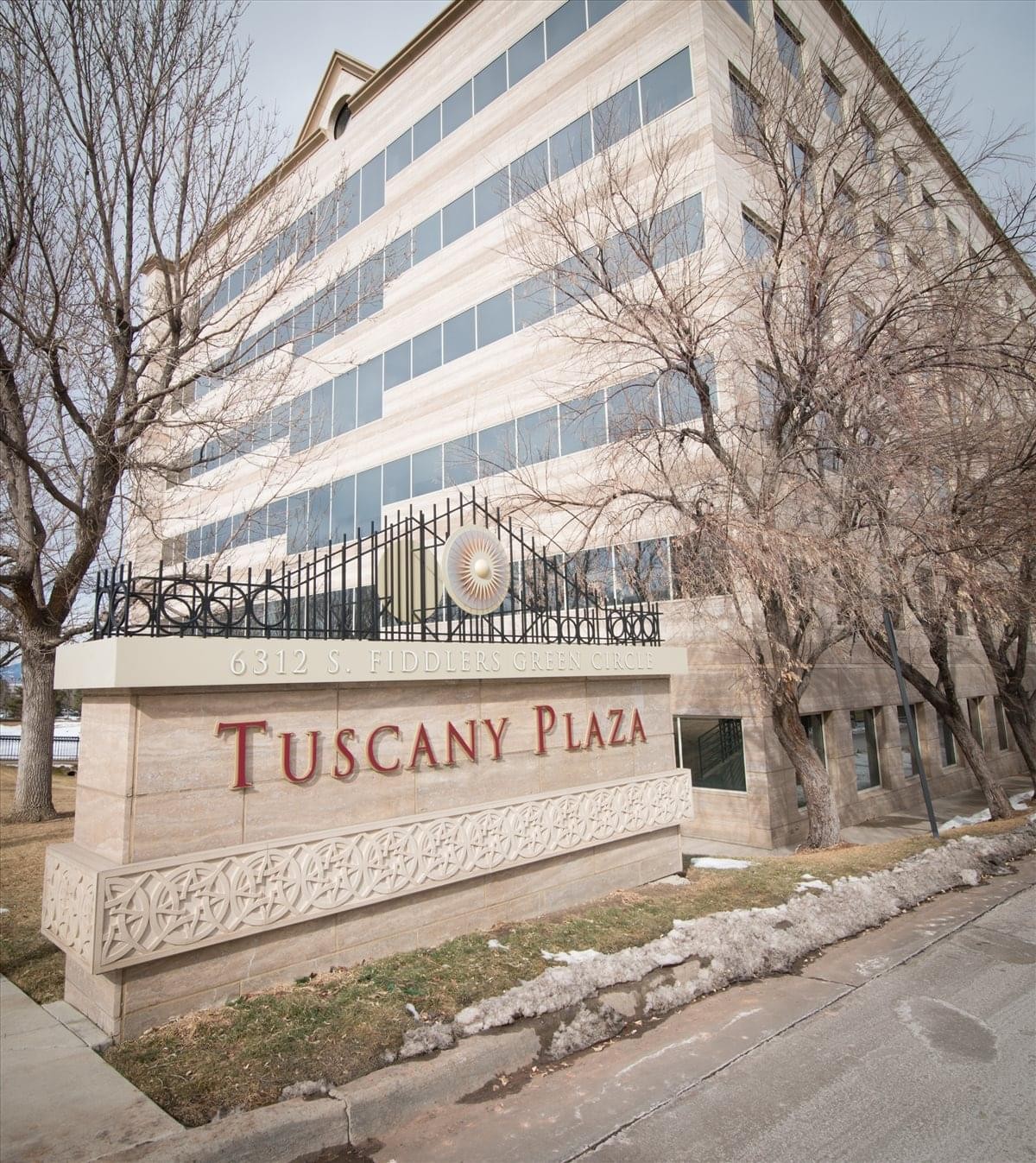 Spacious communal lounge and dining area at Tuscany Plaza Business Center.
