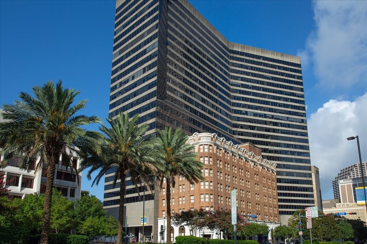 Exterior view of the high-rise St. Charles Business Centre against a clear blue sky.