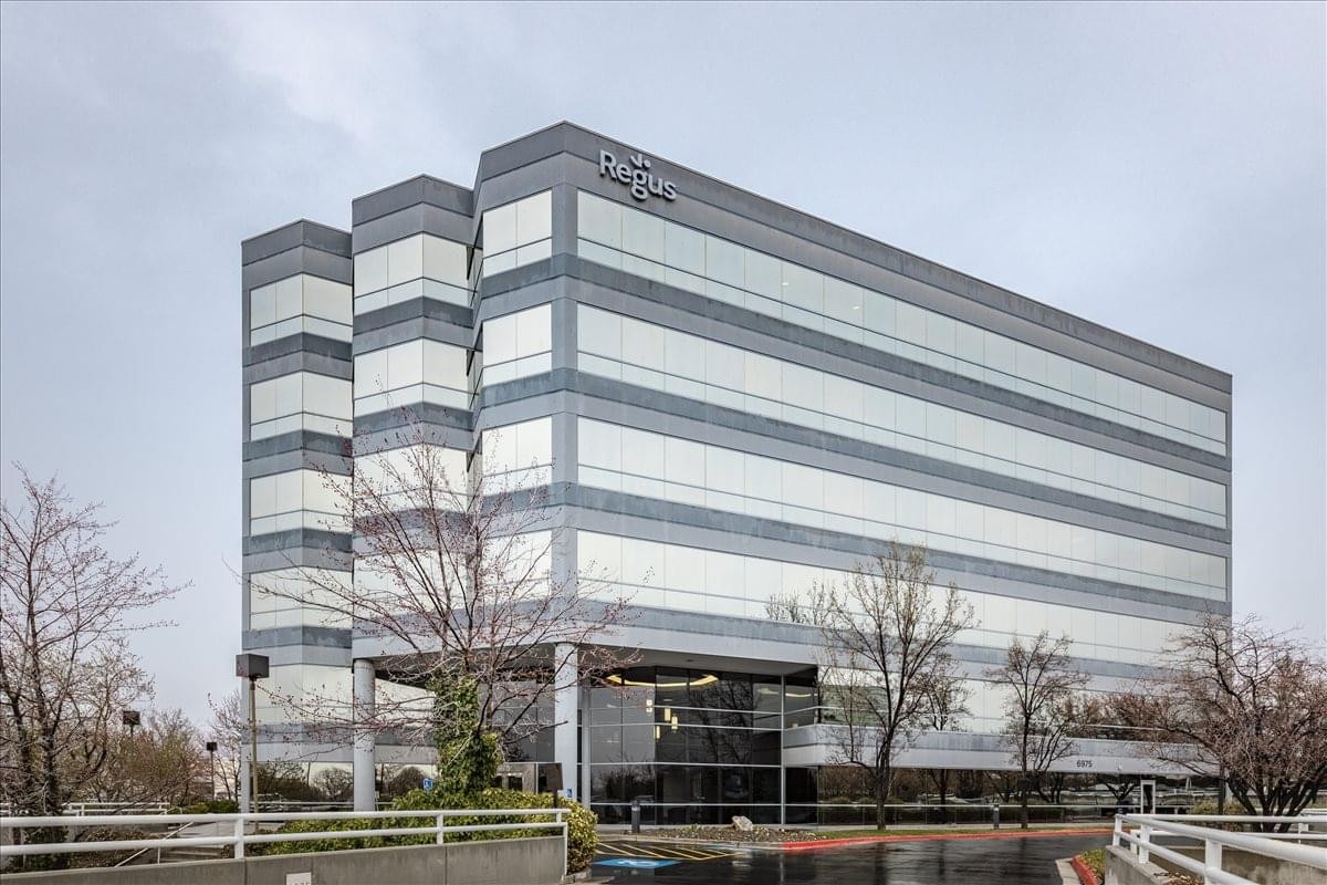 Exterior view of the modern multi-story office building at 6975 Union Park Avenue.
