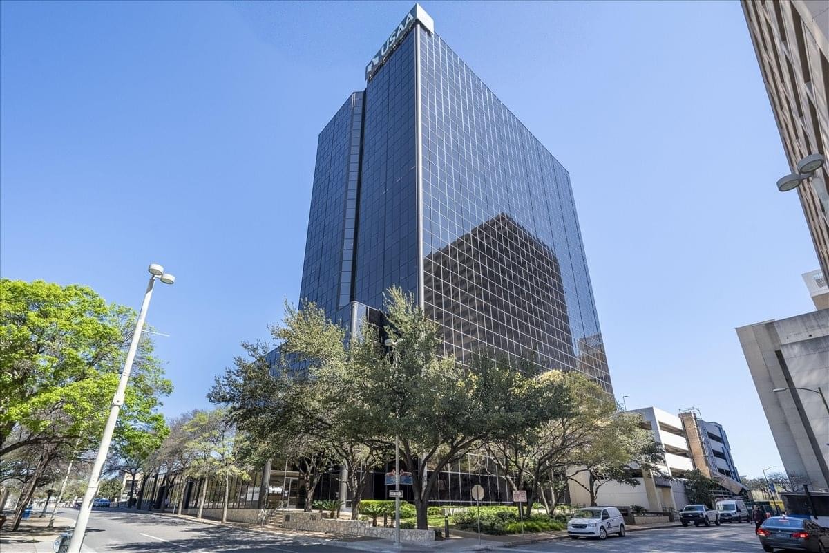 Exterior view of the dark glass facade skyscraper at 700 N. St. Mary’s.