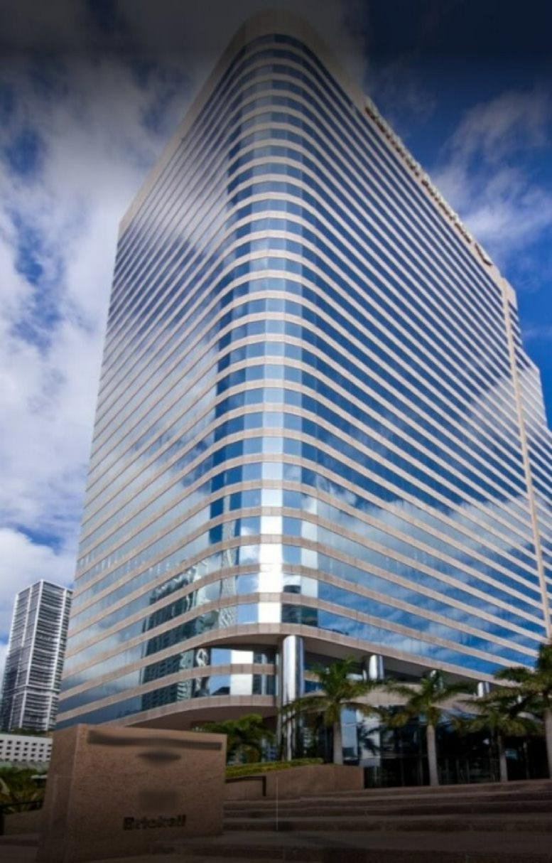 Exterior view of the glass-facade skyscraper at 701 Brickell Avenue.