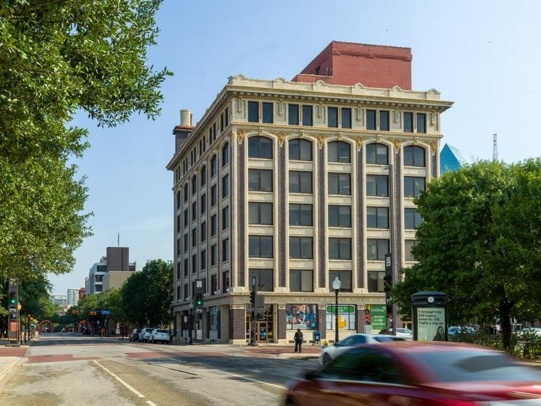 Exterior view of the historic brick building at 701 Commerce Street.