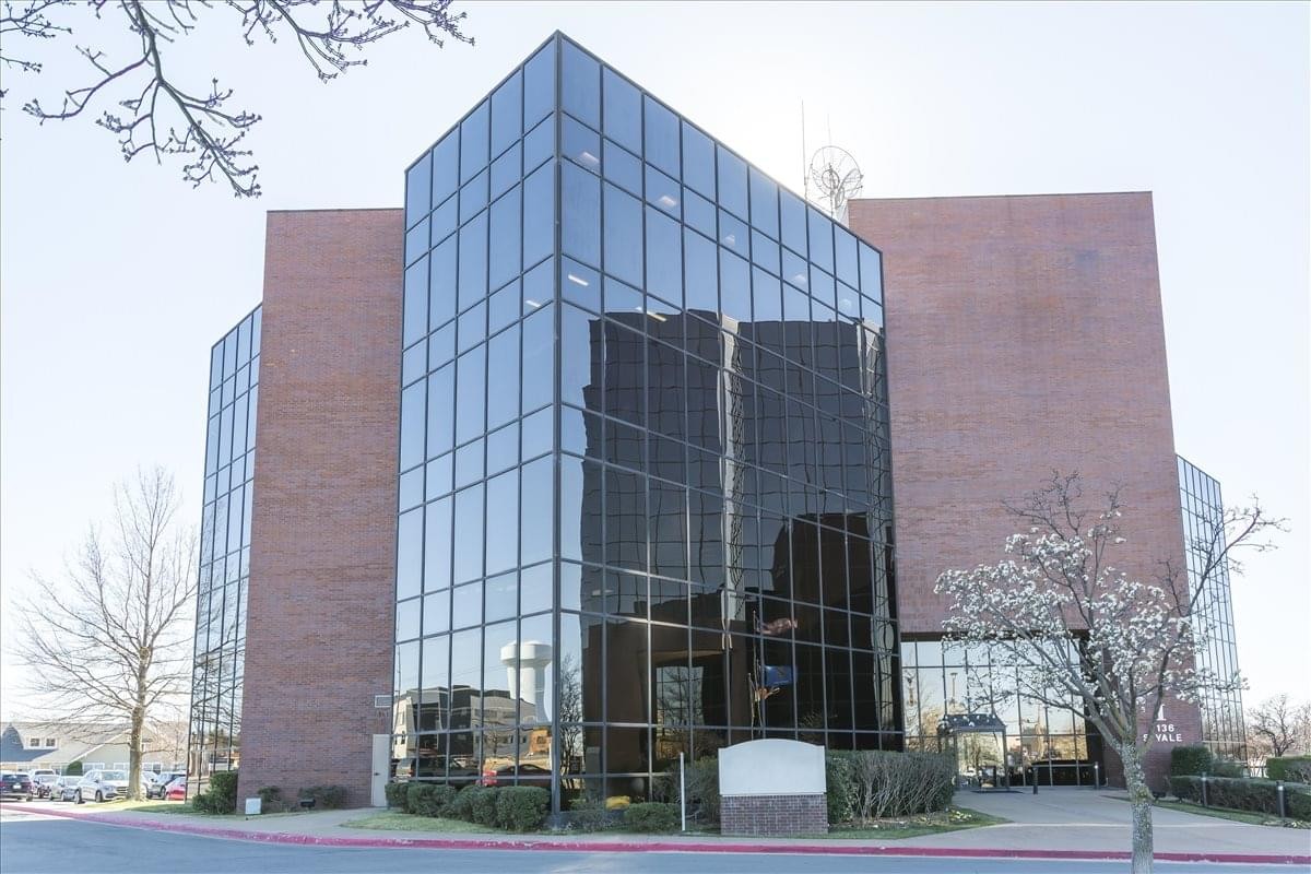 Exterior view of the brick and glass Executive Tower Centre at 7136 S. Yale Avenue.