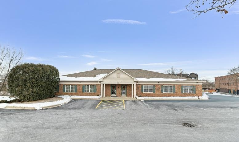 Exterior view of the brick facade and entrance at Roselle Corporate Center.