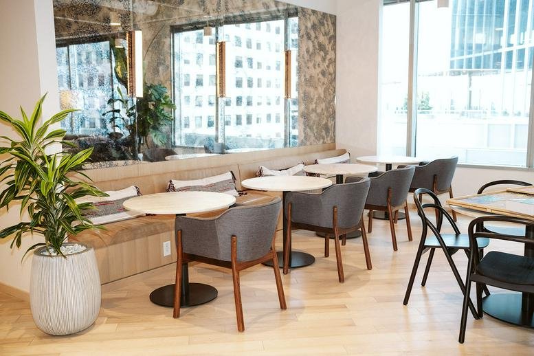 Casual dining area with tables and chairs.