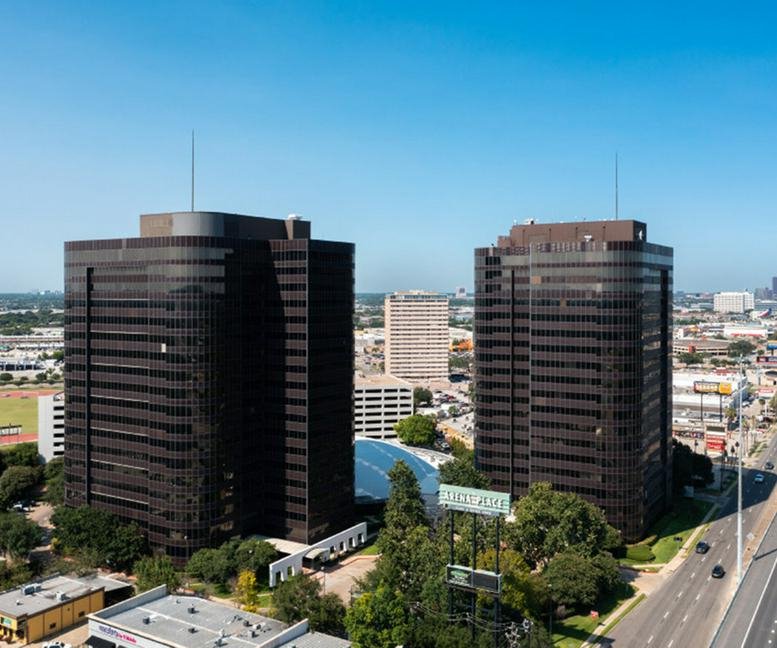 Aerial view of the twin brown office towers at 7322-7324 Southwest Freeway.
