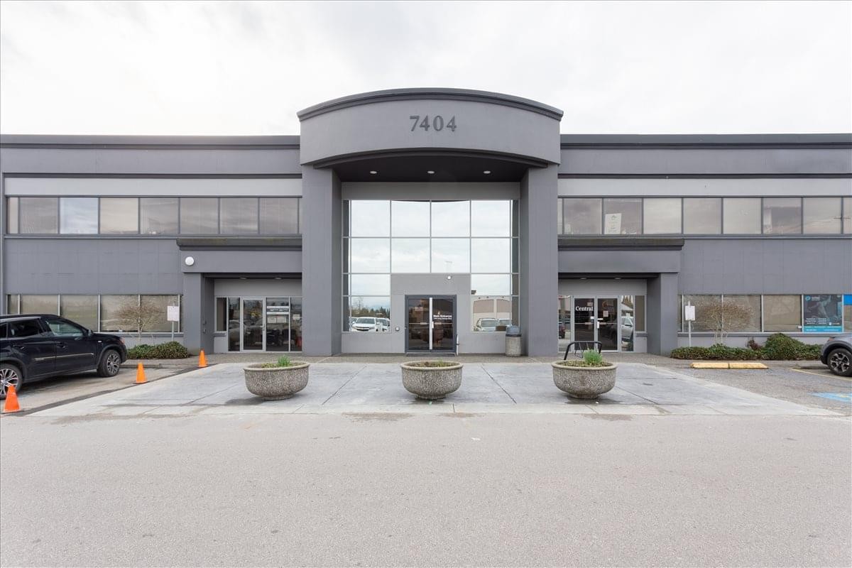 Exterior view of the professional grey facade at 7404 King George Boulevard, Suite 200.
