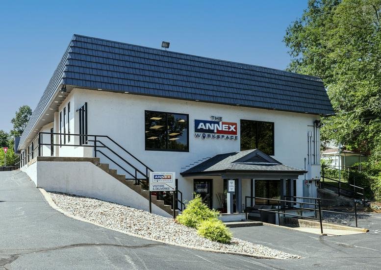 Exterior view of the white facade building of The Annex Workspace.
