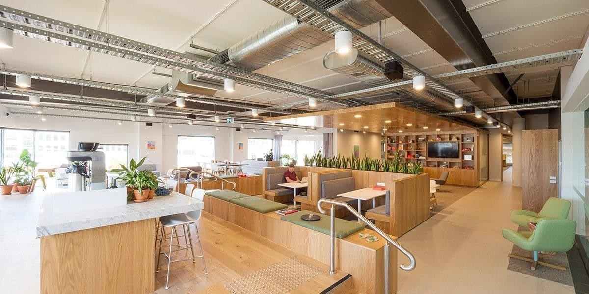 Spacious interior workspace at 777 S. Alameda St, STE 220 & 260 with wood accents and industrial ceilings.