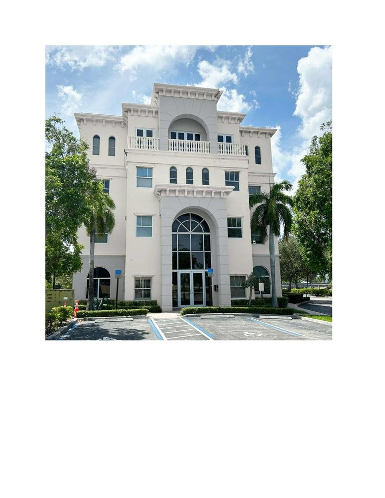 Exterior view of the classical tan building at 7999 N Federal Highway.