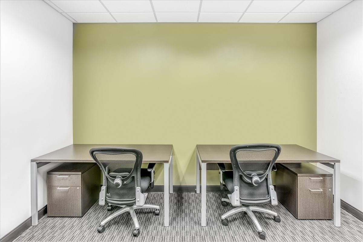 Symmetrical two-person office suite at 800 S. Gay Street, Suite 700 with sage green feature wall.