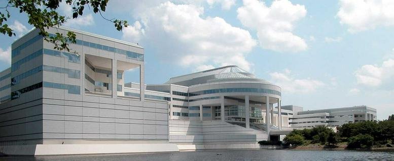 Exterior view of the white tiered building at 800 Westchester Avenue.