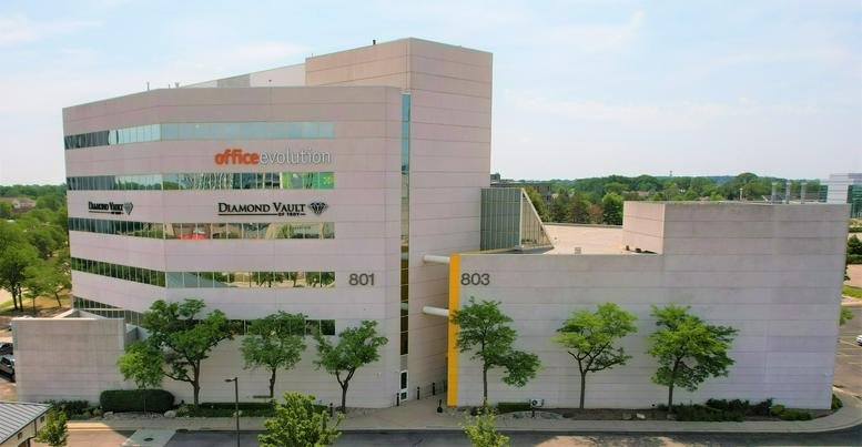 Exterior view of the multi-story office building at 801 W Big Beaver Road, Suite 300.