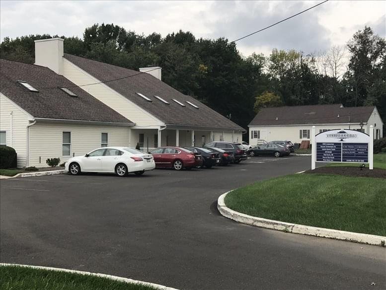 Exterior view of the white professional building and parking area at 81 Big Oak Rd, Yardley, PA.
