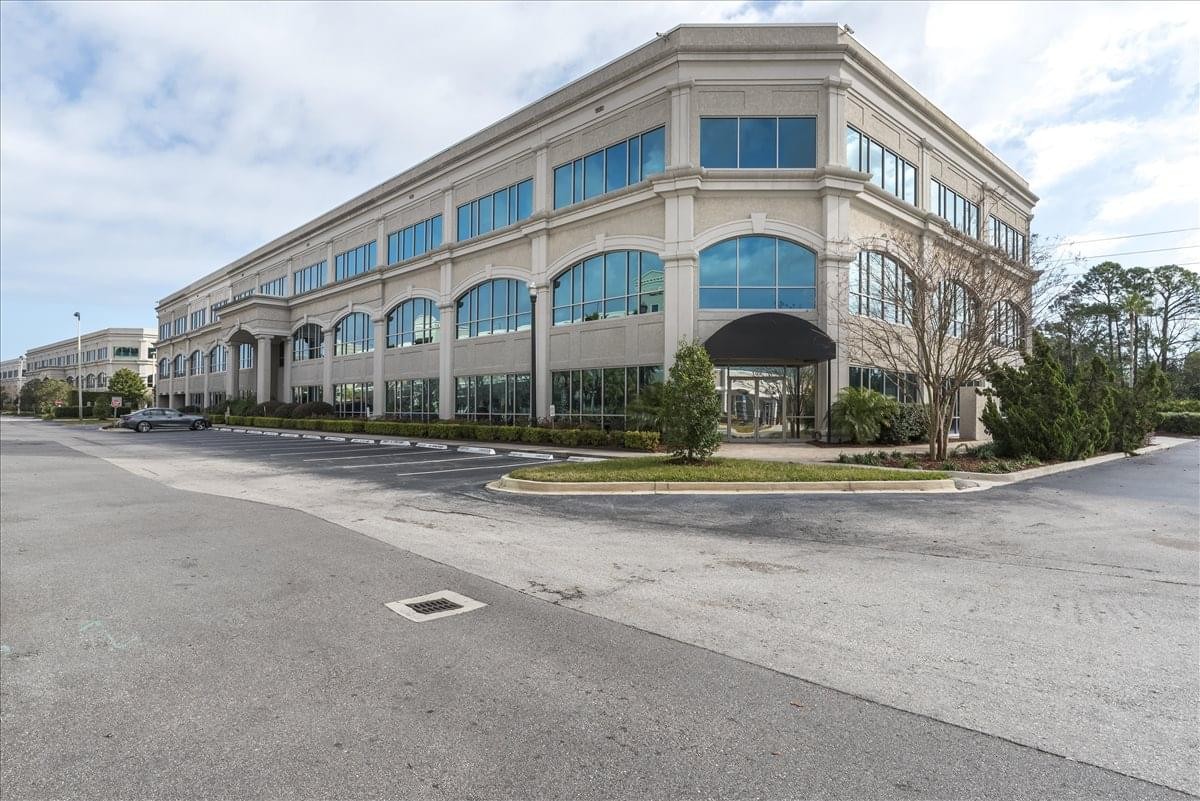 Exterior view of the multi-story stone-clad building at 822 N. A1A Highway.
