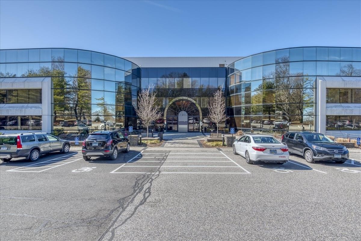 Exterior of the glass-facade Lee Farm Corporate Park building at 83 Wooster Heights Road.
