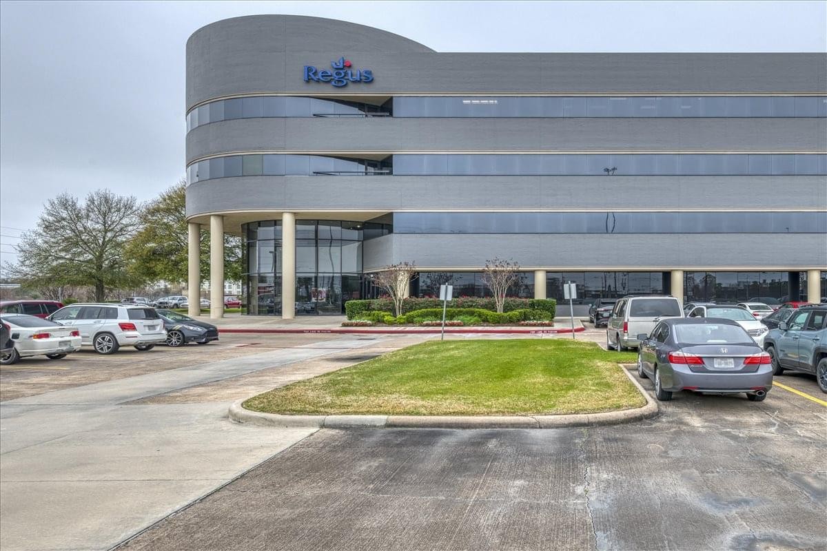 Modern curved exterior facade of the Willowbrook Business Center building.