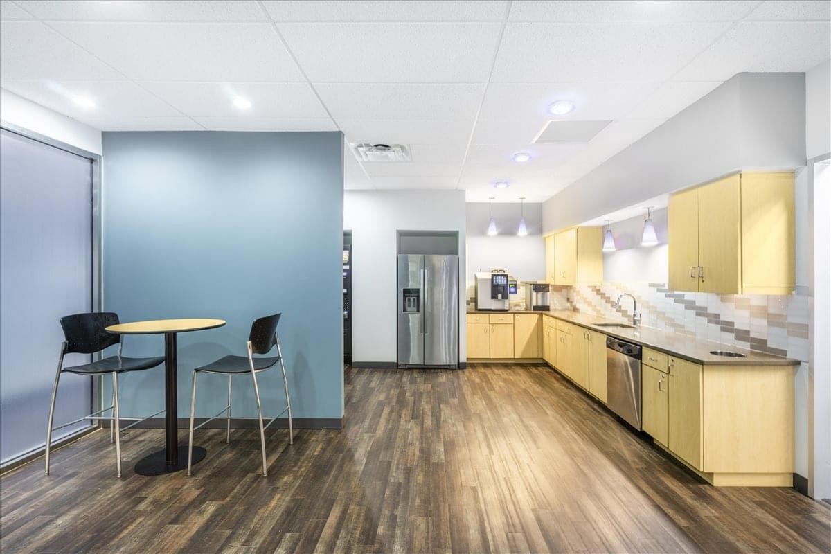 Modern breakroom at 841 Prudential Drive, 12th Floor featuring a café table and full kitchen.