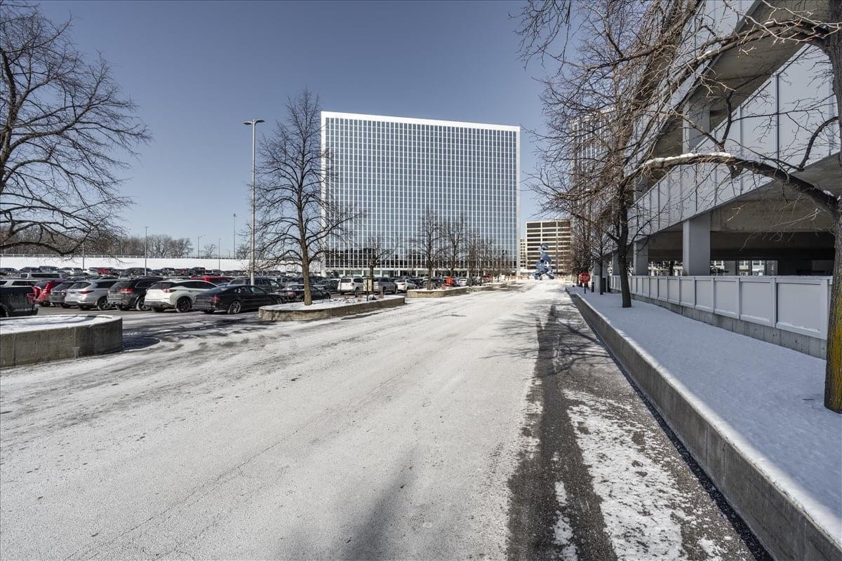 Exterior of the glass-facade building at 8770 West Bryn Mawr Avenue, Suite 1300.