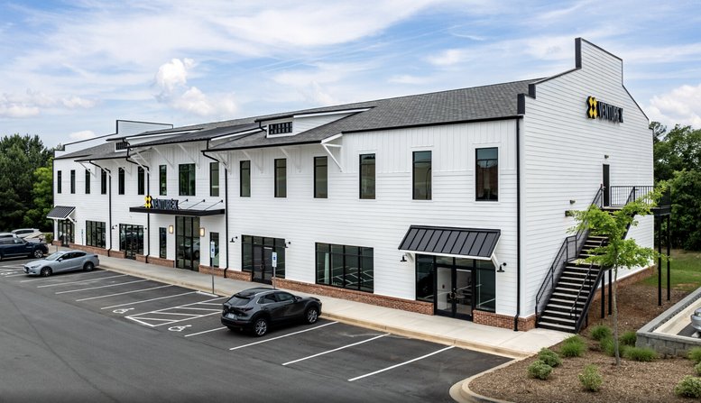 Exterior view of the white paneled building at Wilson Farms, 885 Gold Hill Road.