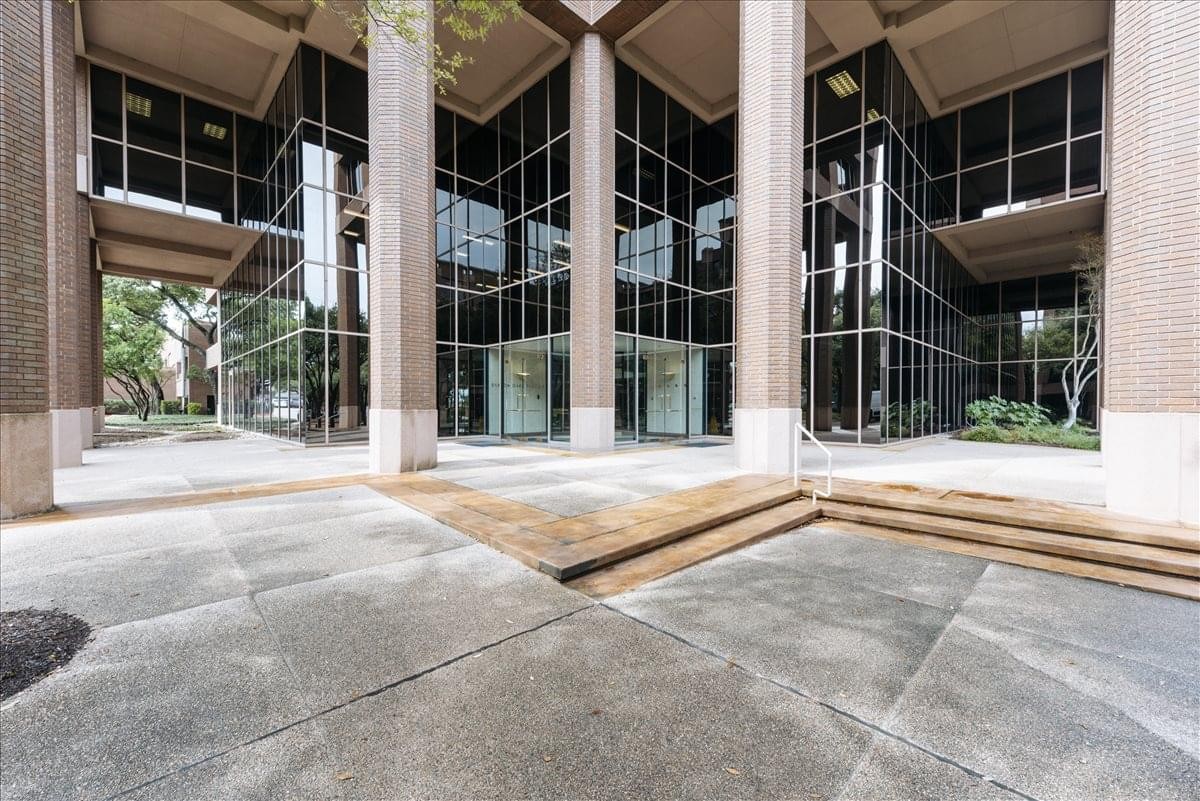 Exterior view of the modern glass and stone building at 901 Mopac Expressway South.