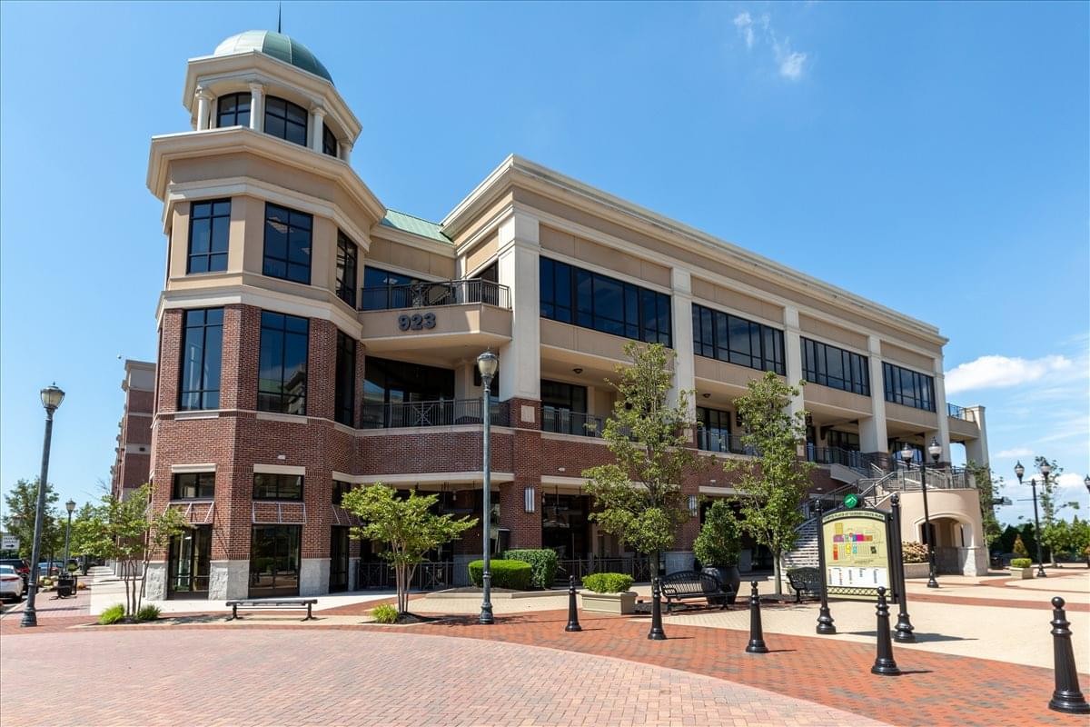 Exterior view of the traditional brick and stone building at 923 Haddonfield Road.