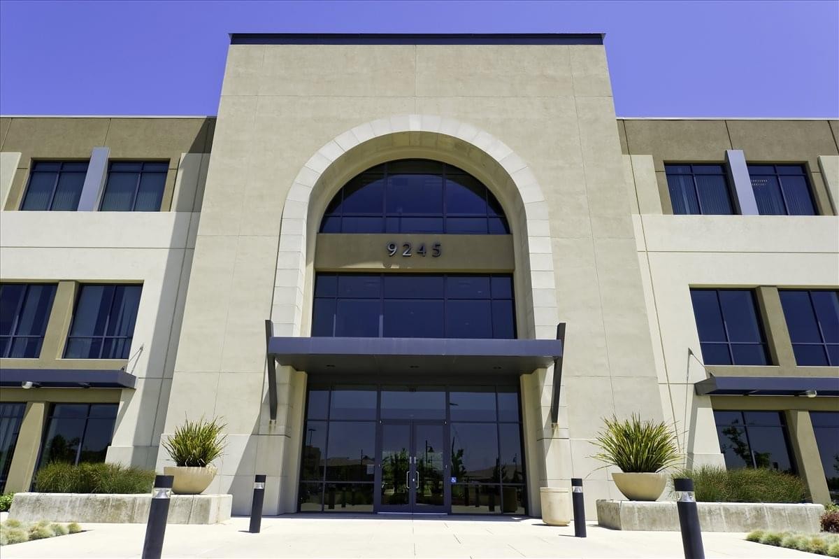 Symmetrical front exterior and arched glass entrance at 9245 Laguna Springs Drive.