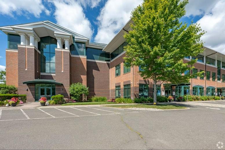 Exterior view of the brick and glass facade at 93 Lake Avenue, Suite 102.