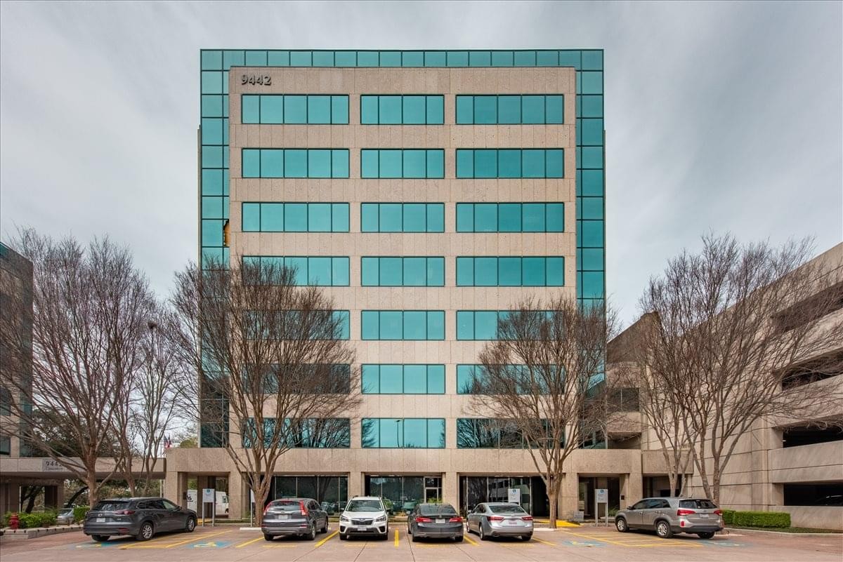 Exterior view of the glass-facade Arboretum Plaza building at 9442 Capitol of Texas Highway North.
