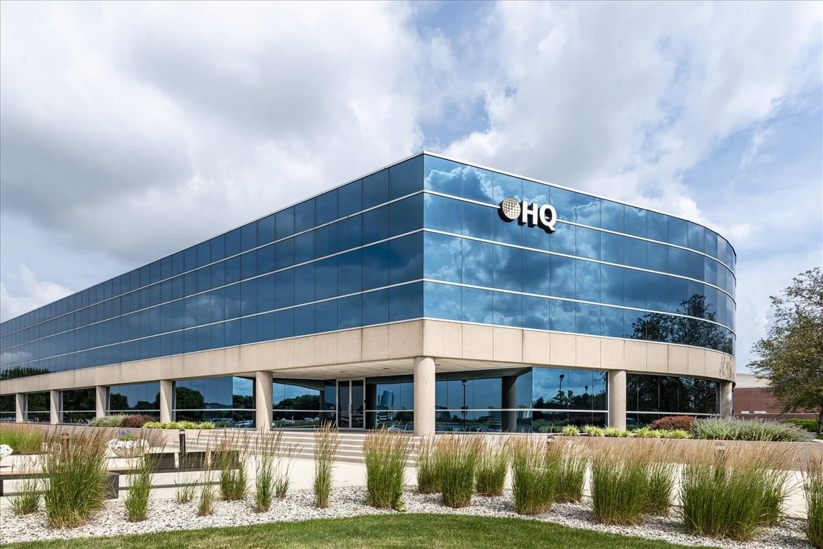 Exterior view of the glass-facade 9465 Counselors Row building.