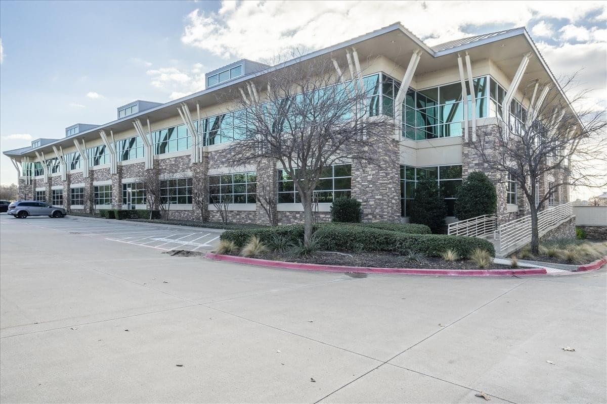Modern stone and glass exterior of the 950 E. State Highway 114 office building in Southlake.
